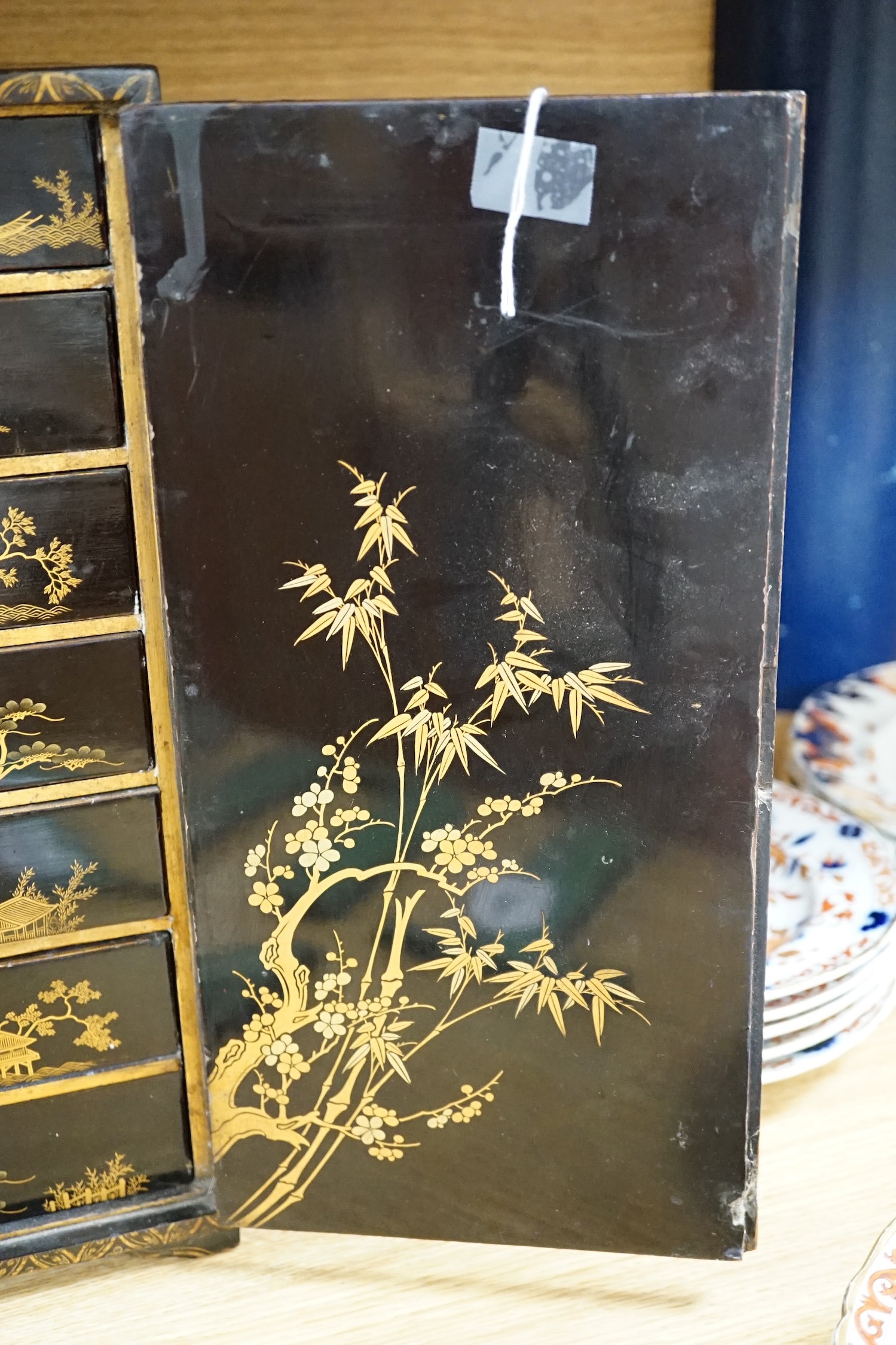 A 19th century Japanese gilt lacquered table cabinet, 38cm tall. Condition - fair
